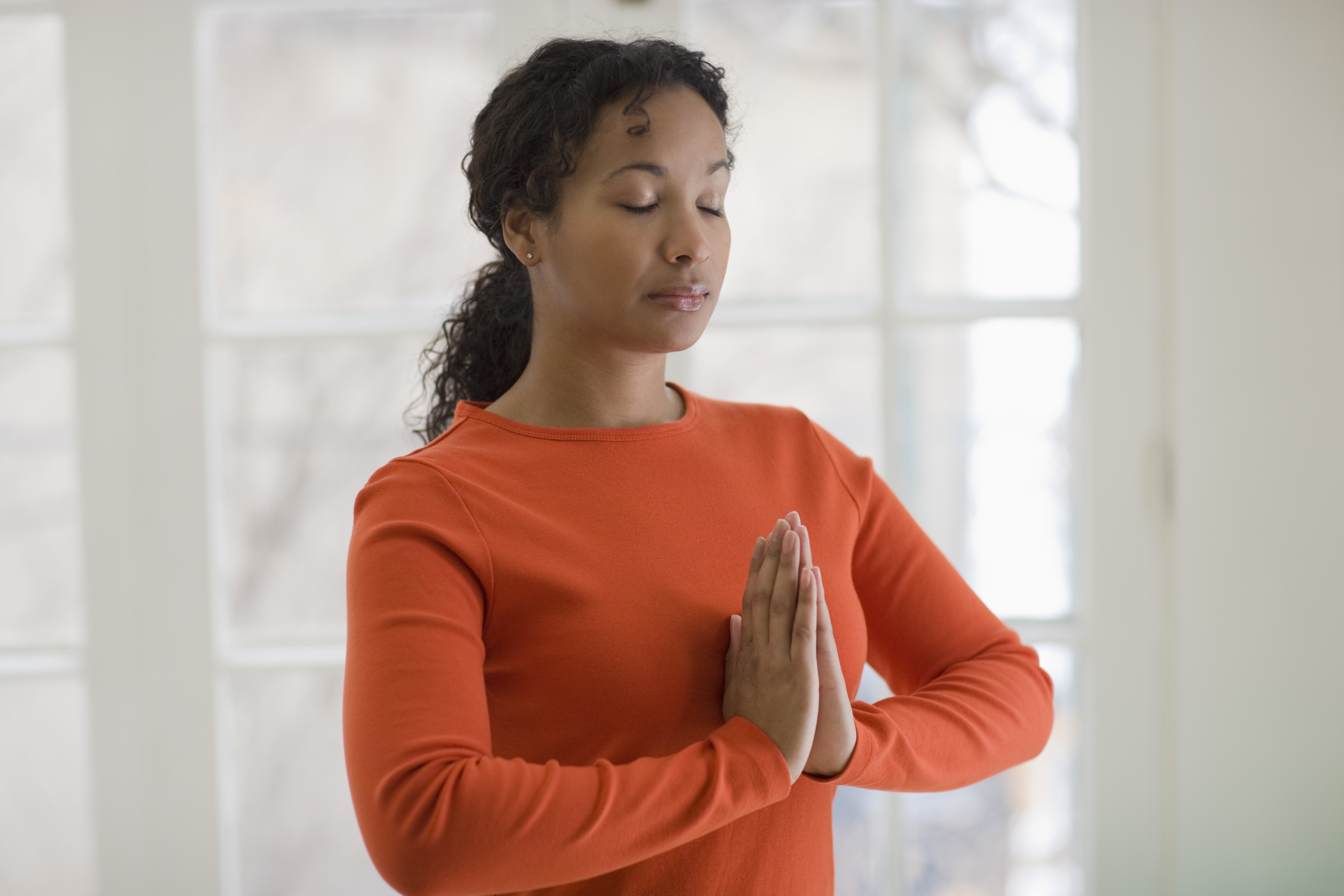 Young African American woman in yoga pose