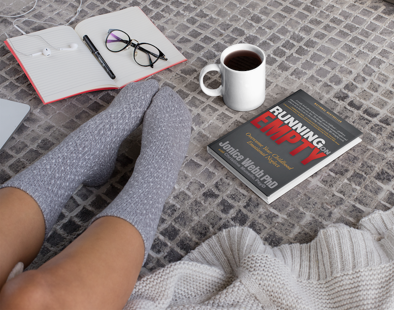 mug and roe book placed on the floor